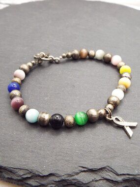VINTAGE STERLING SILVER RAINBOW CAT'S EYE WITH AWARENESS RIBBON BRACELET K